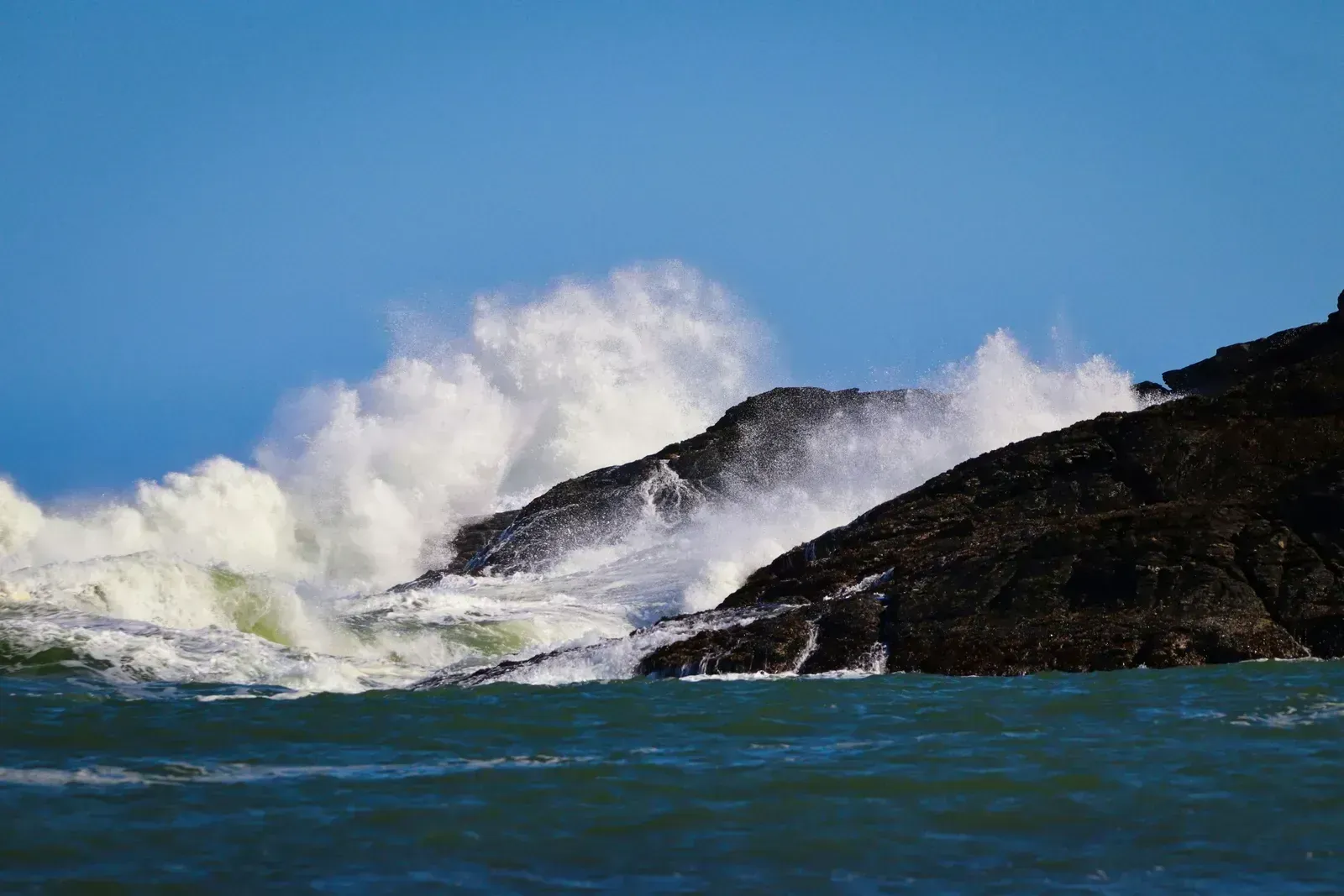 Atlantic swells burst white against the rocks of the wild south coast