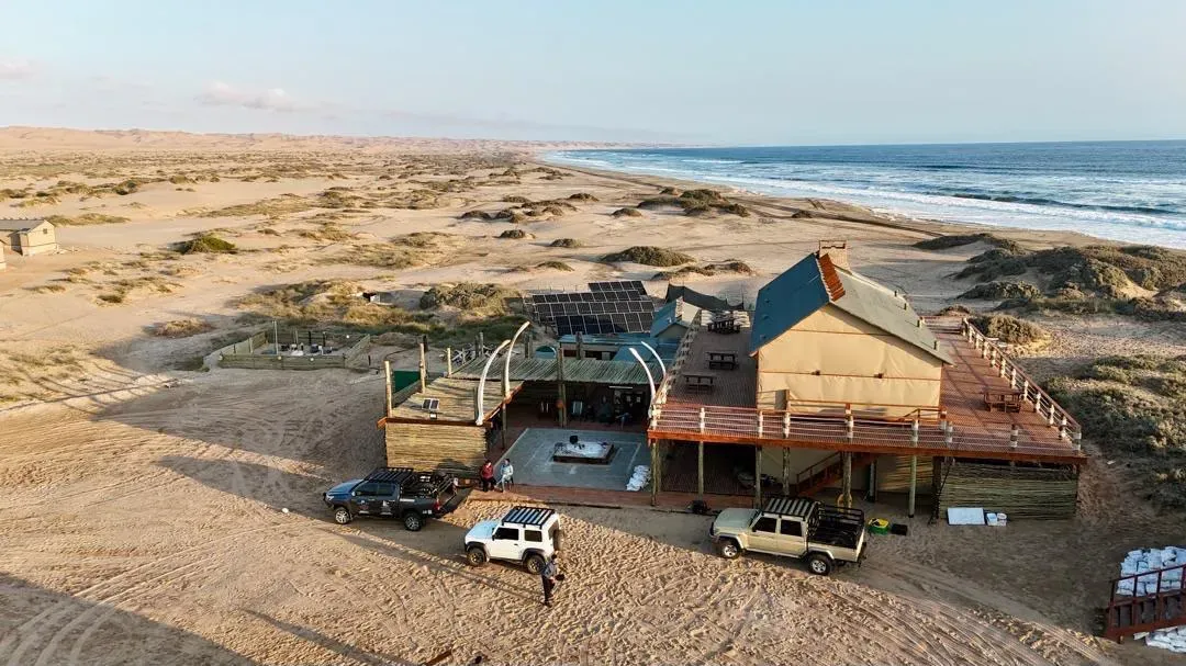 Aerial view of Meob Lodge and its whalebone arches by the sea